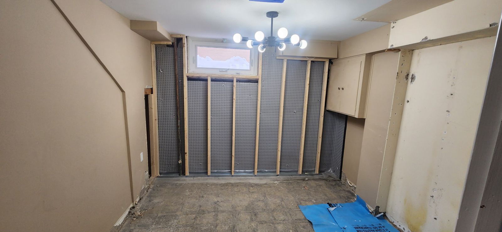 Before: Recreation room — accent wall and finish prep