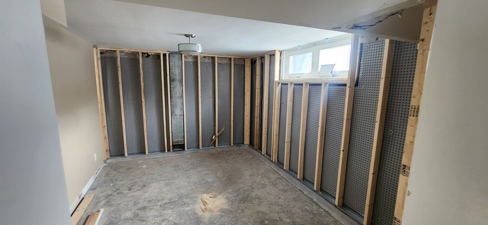 Before: Laundry hallway — new doors and patchwork